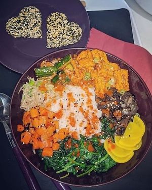 Home delivery of Korean Bibimbap: spicy tofu, pepper spice, kimchi, wilted sesame spinach, carrots & nori, marinated beansprouts, mixed mushrooms in soy & sesame crunch biscuits at Blue Moon Cafe in Sheffield