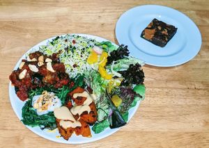 Imam bayeldi, rice with barberries & herbs, roast pumpkin with harissa & sweet tahini, wilted spinach with yogurt/dukkah, orange/fennel salad.
Chocolate, & cranberry brownie at Blue Moon Cafe in Sheffield