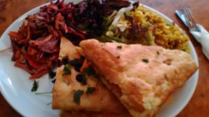 Marinated tofu sandwich on olive bread with rice and salad. at Herbies in Exeter