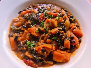 Black bean casserole, I had this with vegan cheesy garlic bread, so good! at Herbies in Exeter