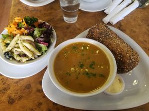 Sweet potato and coconut soup with vegan butter and granary bread and a wonderful side salad bowl at Herbies in Exeter
