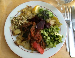A selection of hot and cold items from the buffet, including ratatouille in a tomato sauce, sautéed potatoes, cabbage, leeks, a cucumber salad and red beets at Country Life in Marseille