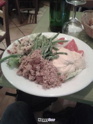 Simple salad with non-vegan houmous (crazy!) that I did not eat, as a consequence... at La Faim des Haricots - Puits Vert in Toulouse