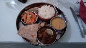 Vegan thali: rice, eggplant, chapati, vegetables at Manger Autrement in Toulouse