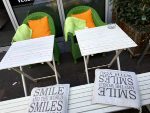 chairs to street front at Osho's Place in Cologne