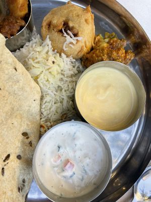 Vegan thali- mango dessert, spicy dip, yoghurt   at Osho's Place in Cologne