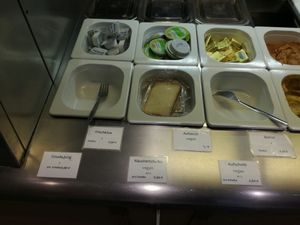 vegan breakfast options are visibly marked at Osho's Place in Cologne