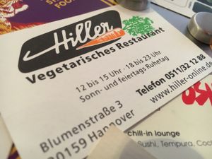 Business card with opening times at Hiller in Hannover
