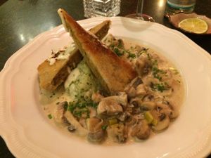 Mushrooms in a cream sauce with crispy housemade seitan and risotto with bears' garlic. So good! at Hiller in Hannover