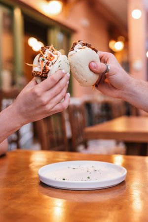 Cheers to delicious bites! Oyster Mushroom Bao Buns - Can't stop at one. 🍄🥂 at ThirdEye in Crete
