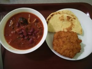 Spicy sabji, naan bread and deep fried potato donut at Govinda I in Budapest