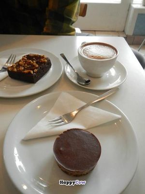 Vegan banana and spelt brownie, soy cappuccino, and vegan 'snickers' raw pie cup at Kaffihusid Gardurinn - Ecstasy's Heart-Garden in Reykjavik