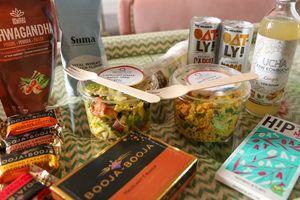 products from the store - pasta salad, couscous salad, oat milk chocolate, booja truffles, oatly coffees, , kombucha, seitan flour, etc. at Quay Co-op Market in Cork