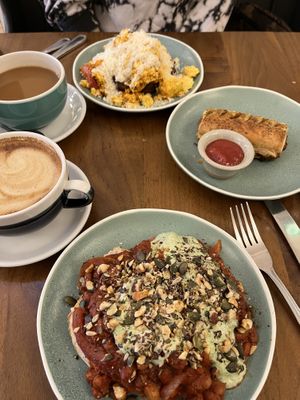 Vegan tofu scramble, vegan sausage roll, and beans on toast with an oat milk latte & americano  at Cornucopia in Dublin