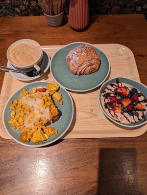 Tofu scramble, overnight oats, pain au chocolate, soy latte at Cornucopia in Dublin