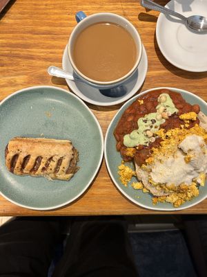 Sausage roll, Americano with oat milk, 50/50 beans and tofu toast   at Cornucopia in Dublin
