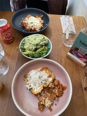 We both got the lasagna. It was AMAZING 😍 The bowl in the middle is a mix of two salads. One was the potato salad and the other was pesto pasta. Both were delicious 🥰 at Cornucopia in Dublin