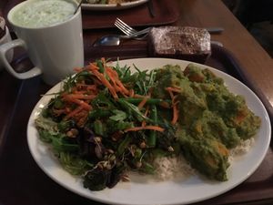 Spinach stew over rice, two salads, banana and sultana bread and matcha latte  at Cornucopia in Dublin