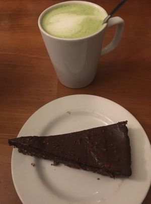 Vegan raw chocolate cake and matcha latte with soy milk  at Cornucopia in Dublin