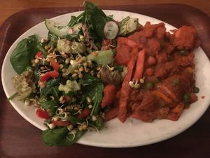 Autumn veg stew - sweet potato, chickpea and parsnip stew in a tomato and roast beetroot sauce on brown  rice with radish and sprout salad  at Cornucopia in Dublin