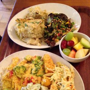 (rear plate) artichoke and fennel pie, sprouted bean salad, and fresh fruit  at Cornucopia in Dublin