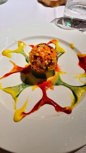 Panzanella con verdure croccanti, cuore di cannellini profumati al wasabi, contrasto di zafferano, lampone e clorofilla at Joia Alta Cucina Naturale in Milan