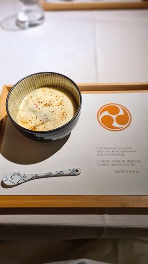 Golosa variazione di ciliegie, pesca e sambuco, crumble di saraceno, gratinati con crema chantilly profumata alla vaniglia at Joia Alta Cucina Naturale in Milan