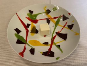 "Carioca" (first dessert course) — Coconut and cacao nib cube with dark chocolate chips, mango and jalapeño sauce, raspberry and acerola at Joia Alta Cucina Naturale in Milan