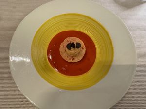 "Brother Sun" — Tomato-strawberry gazpacho, Sicilian "cunzato" bread with capers and wild fennel, plant-based saffron crescenza at Joia Alta Cucina Naturale in Milan
