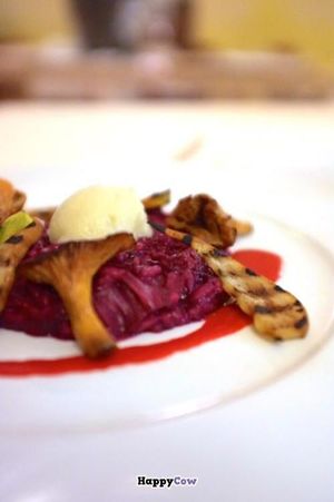 'L'ombelico del mondo' italian real risotto with reduction of wine and mushrooms  at Joia Alta Cucina Naturale in Milan