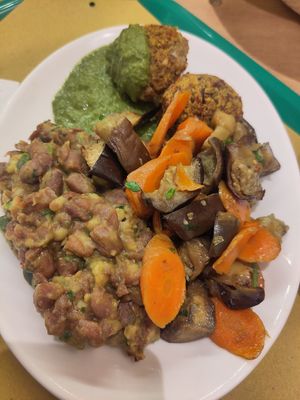 3 dishes (here polpette, salad and borlotti) for €13 at Centro Natura in Bologna