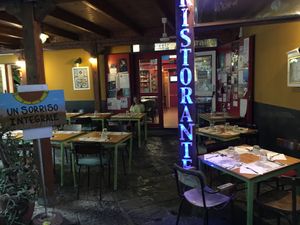 This is the restaurant from inside the court, showing outdoor dining. at Amico Bio - Un Sorriso Integrale in Naples