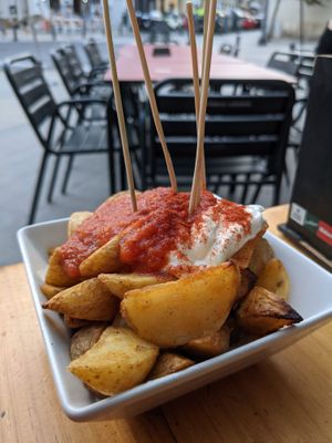 Patatas bravas:
Papas asadas al horno con salsa casera at Jardin Urbano in Valencia