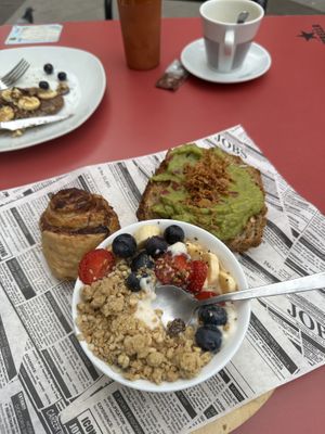 Brunch special with croissant, guacamole toast, and yogurt with fruit  at Jardin Urbano in Valencia