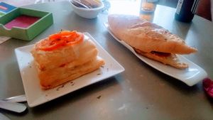 Cheese and tomato puff pastry and pulled pork bocadillo.  at Jardin Urbano in Valencia