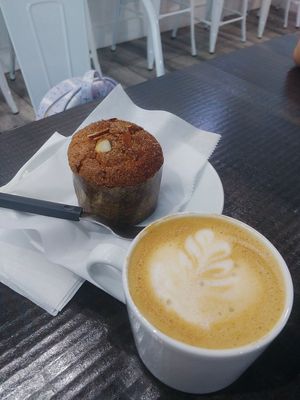 Vegan banana chocolate chip muffin and oatmilk cappuccino at White Rose Coffee in Miami