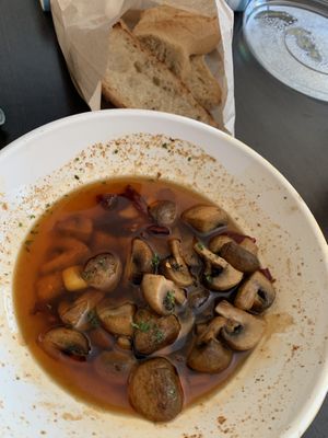Ajillo mushrooms with sourdough baguette at South Restaurant + Coffeehouse in Anchorage