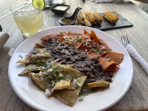Chilaquiles divorciados, elotes, and margarita   at Capuchino Cafe in La Paz