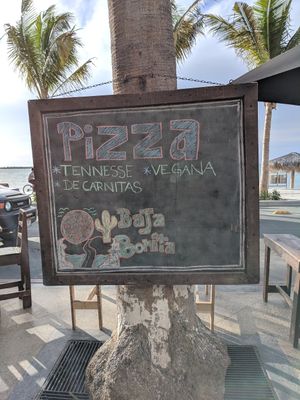 Pizza sign on the Malecon showd vegan option at Baja Bonita Cerveceria Artesanal  in La Paz