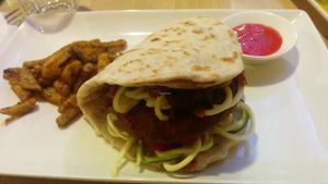 Bar-Bea Burger 83 Kn (~11€)
Barley-bean-smoked seitan burger. Naan bread to help keeping your fingers clean. Sweet potato sticks. Topped with onion BBQ and homemade senf sauce. Vegan.  at Nishta in Dubrovnik