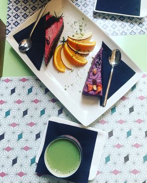 Berry cake, chocolate cake and a matcha latte  at Nishta in Dubrovnik