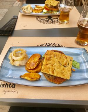 Smoked tofu burger with sweet potato and onion rings  at Nishta in Dubrovnik