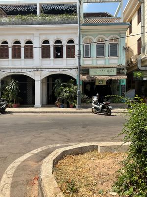View of New Leaf Eatery fro next to the waterwheel /triangle roundabout  at New Leaf Eatery in Siem Reap