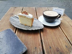 Lemon cake and oatmylk cappucchino at Brocca Cafe in Berlin