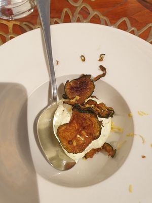Amuse bouche of whipped savoury cream and fried zucchini slices at Il Margutta in Rome