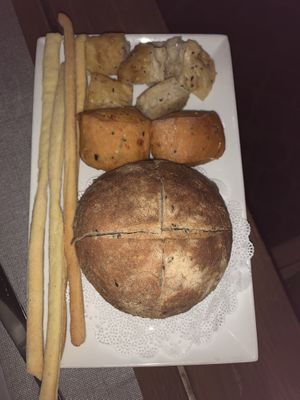 Bread including fresh focaccia and sun dried tomato bread  at Il Margutta in Rome