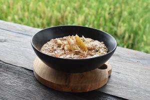 Protein-Packed Overnight Quinoa & Oats - Quinoa, rolled oats & chia seeds soaked in banana & house-made almond milk, with grated apple & a hint of cinnamon at Matcha Cafe in Tibubeneng