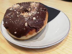 Snickers doughnut: chocolate, caramel and peanut at Delish Vegan Doughnuts in Madrid
