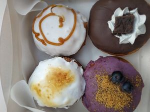 Caramel machiatto, brownie fudgy, blueberry cheesecake, mango at Delish Vegan Doughnuts in Madrid