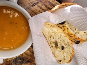 sopita con pan de aceitunas at Naturalia Cafe in Medellin
